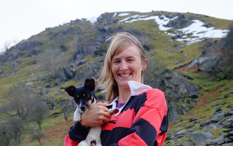 Emma with her dog in the hills