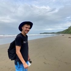 A photo of previous Marine Futures Intern, Adam Rounce, on a beach.