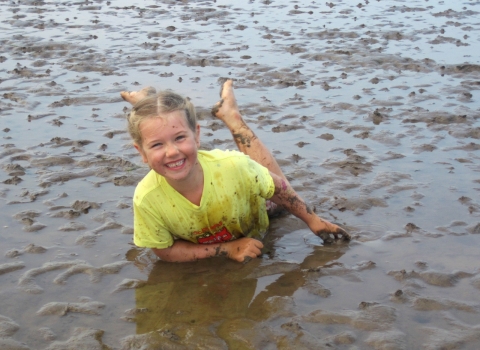 Child having fun in the mud © Kirsten Carter