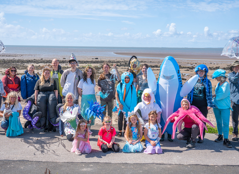 A group of people in marine-themed fancy dress
